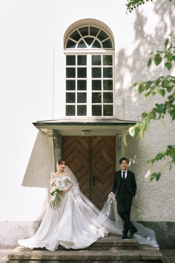 Chang and Alex outside a small church in Lauterbrunnen, Switzerland